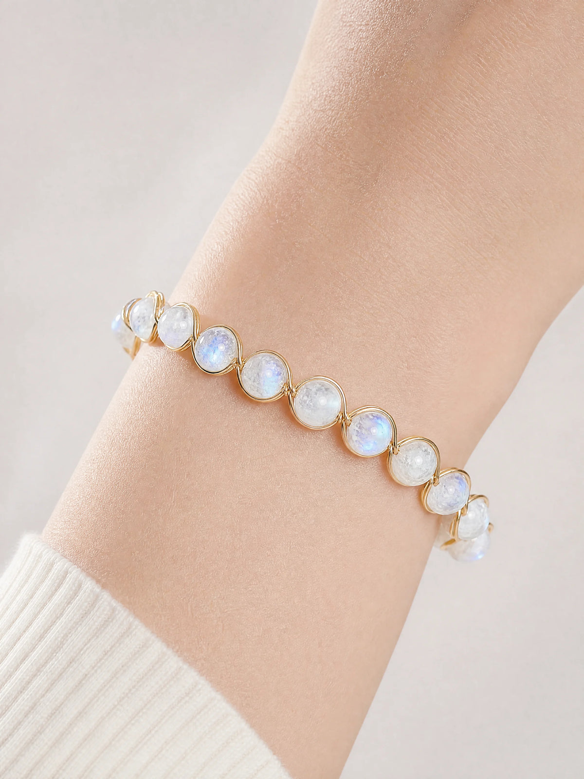14k-gold-filled-blue-flash-moonstone-bracelet-model-a-outfit-a-closeup-01