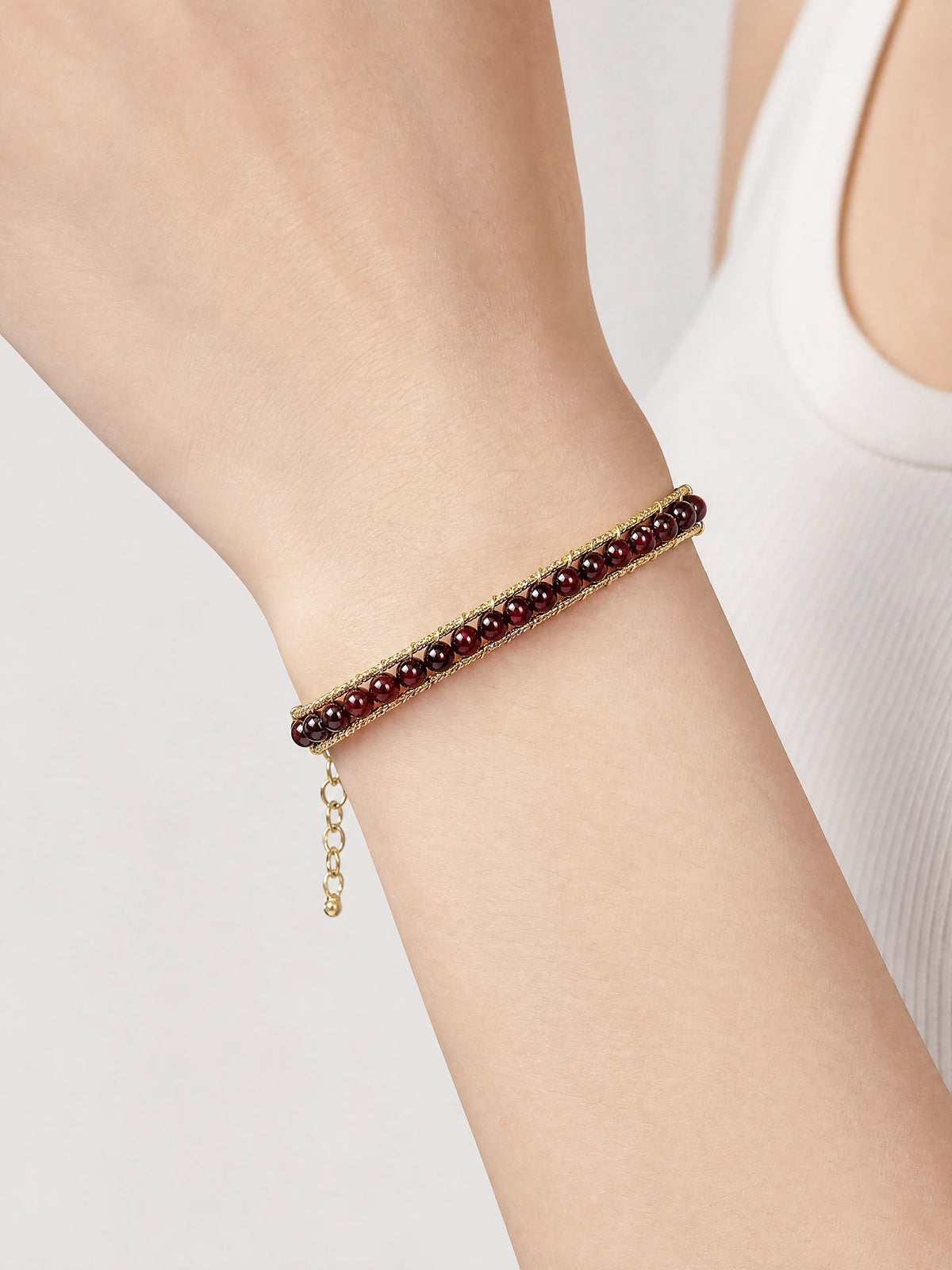 14k-gold-filled-garnet-wire-bracelet-model-a-outfit-a-closeup-01