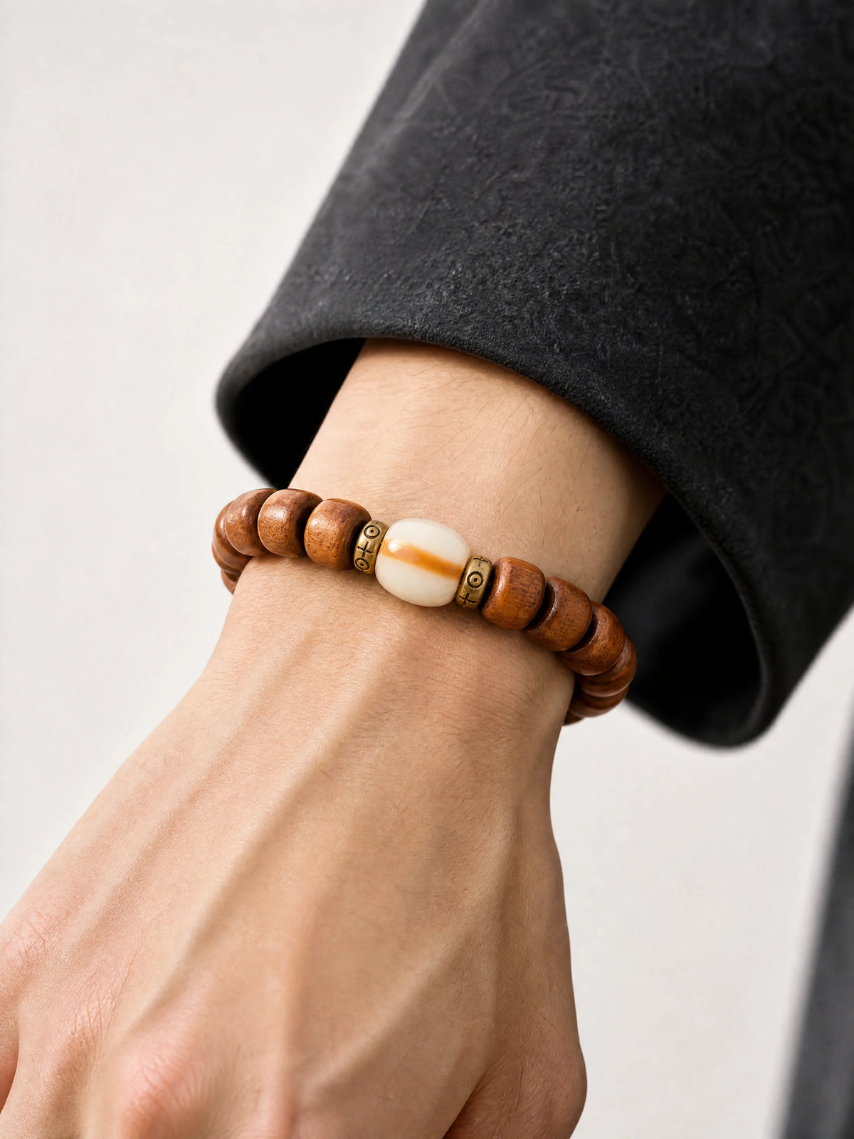 aged-yak-bone-barrel-bead-bracelet-model-a-outfit-a-closeup-01