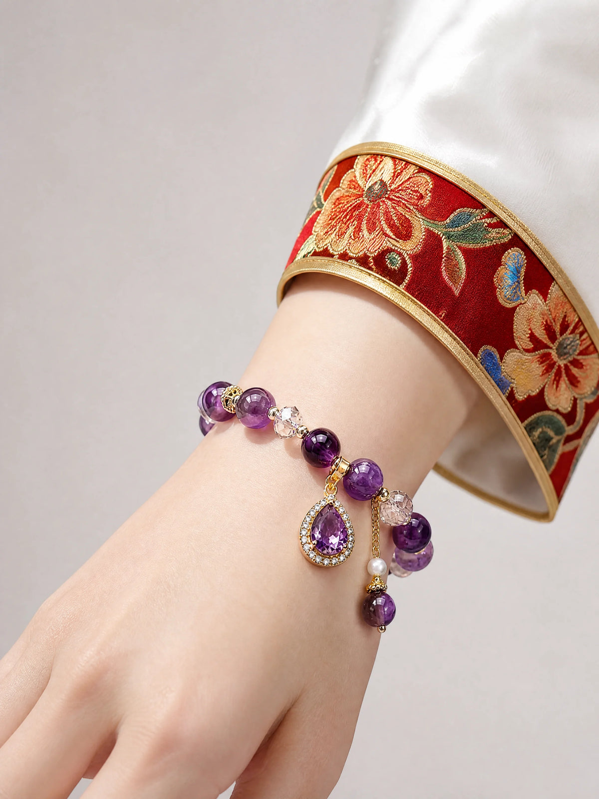 amethyst-water-drop-charm-bracelet-model-a-outfit-a-closeup-01