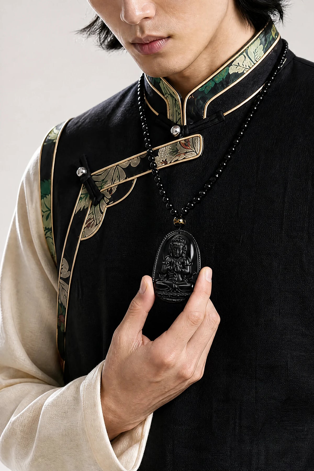 black-obsidian-buddhist-figure-necklace-model-a-outfit-a-fashion-02