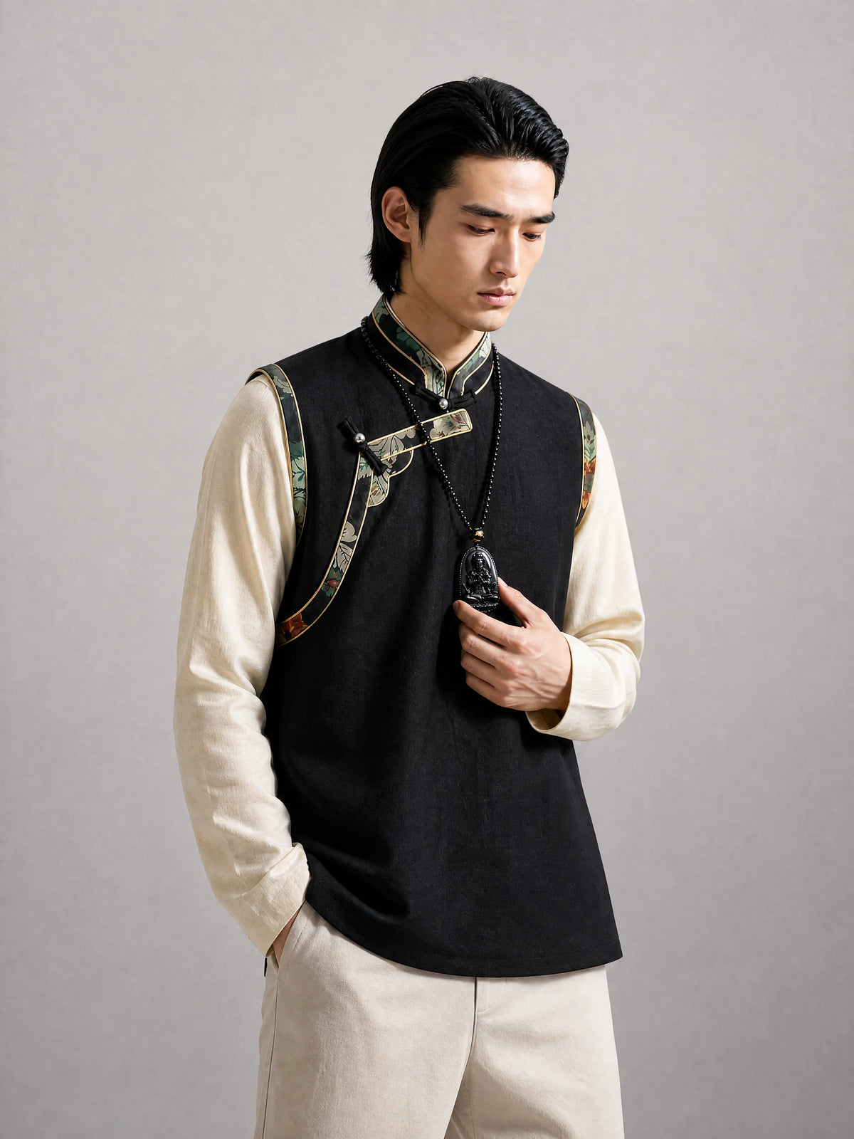 black-obsidian-buddhist-figure-necklace-model-a-outfit-a-fashion-03