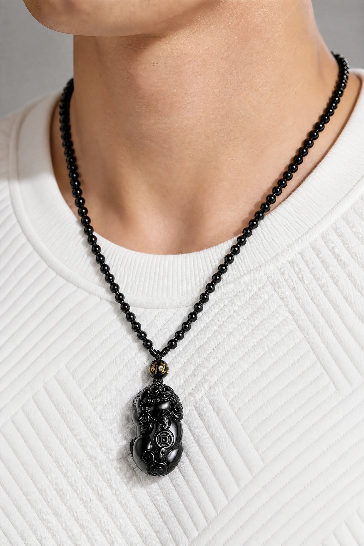 black-obsidian-pixiu-necklace-model-a-outfit-a-closeup-01