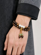 black-rosewood-gold-tassel-wrist-mala-model-a-outfit-a-closeup-01