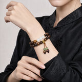 black-rosewood-gold-tassel-wrist-mala-model-b-outfit-b-fashion-01