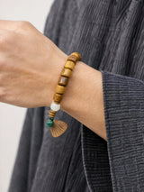 brown-yak-bone-lotus-root-pendant-bracelet-model-a-outfit-a-closeup-01