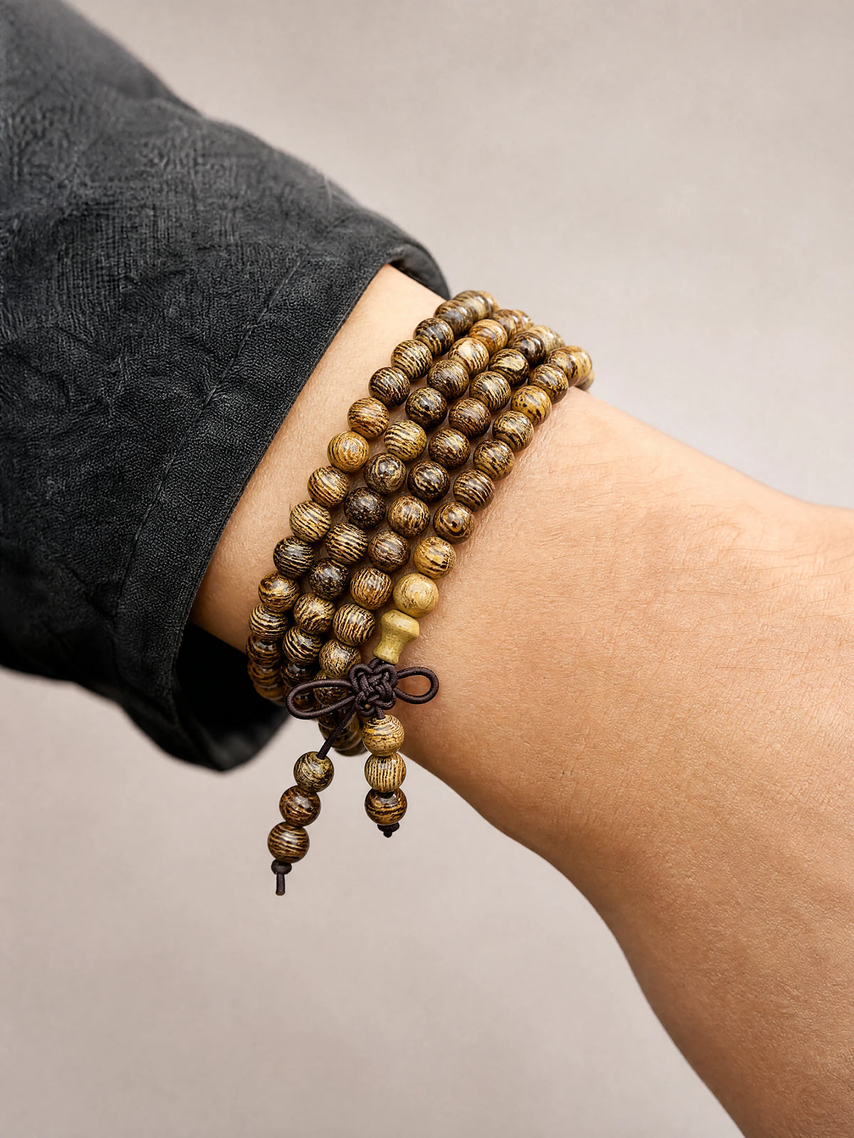 chicken-wing-wood-mala-bracelet-model-a-outfit-a-closeup-01