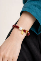cinnabar-fortune-charm-bracelet-model-a-outfit-a-closeup-01