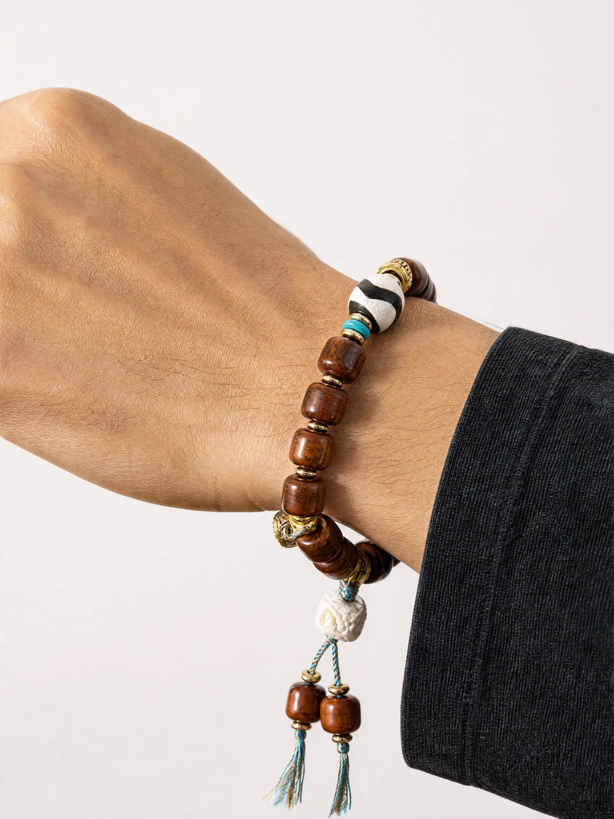dark-yak-bone-dzi-bracelet-protection-model-a-outfit-a-closeup-01
