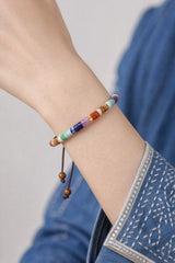 flat-stone-seven-chakra-cord-bracelet-model-a-outfit-a-closeup-01