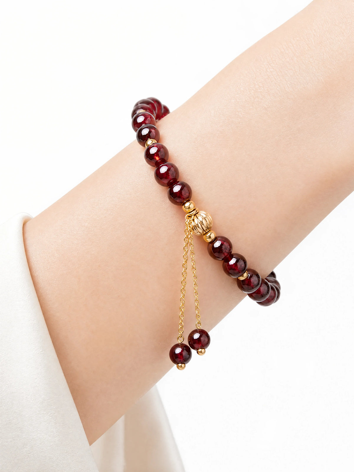 garnet-faceted-double-drop-bracelet-model-a-outfit-a-closeup-01