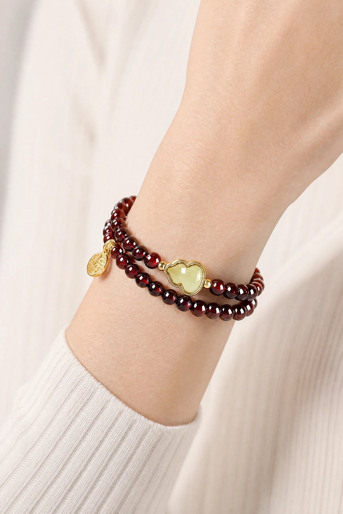 garnet-hetian-jade-gourd-bracelet-model-a-outfit-a-closeup-01