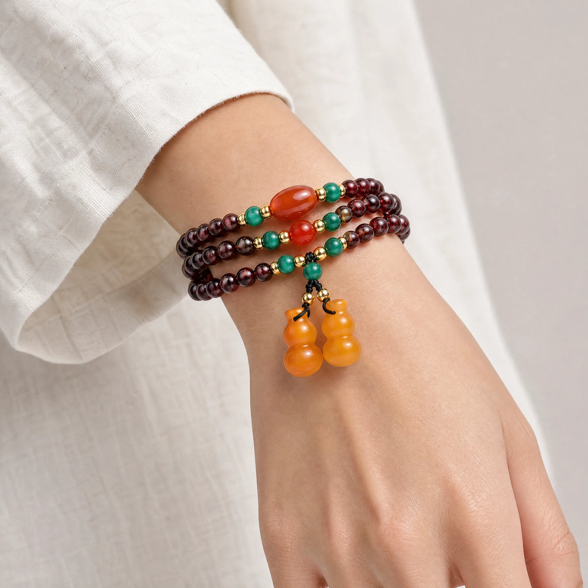 garnet-multi-wrap-double-gourd-bracelet-model-a-outfit-a-closeup-01