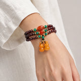 garnet-multi-wrap-double-gourd-bracelet-model-a-outfit-a-closeup-01