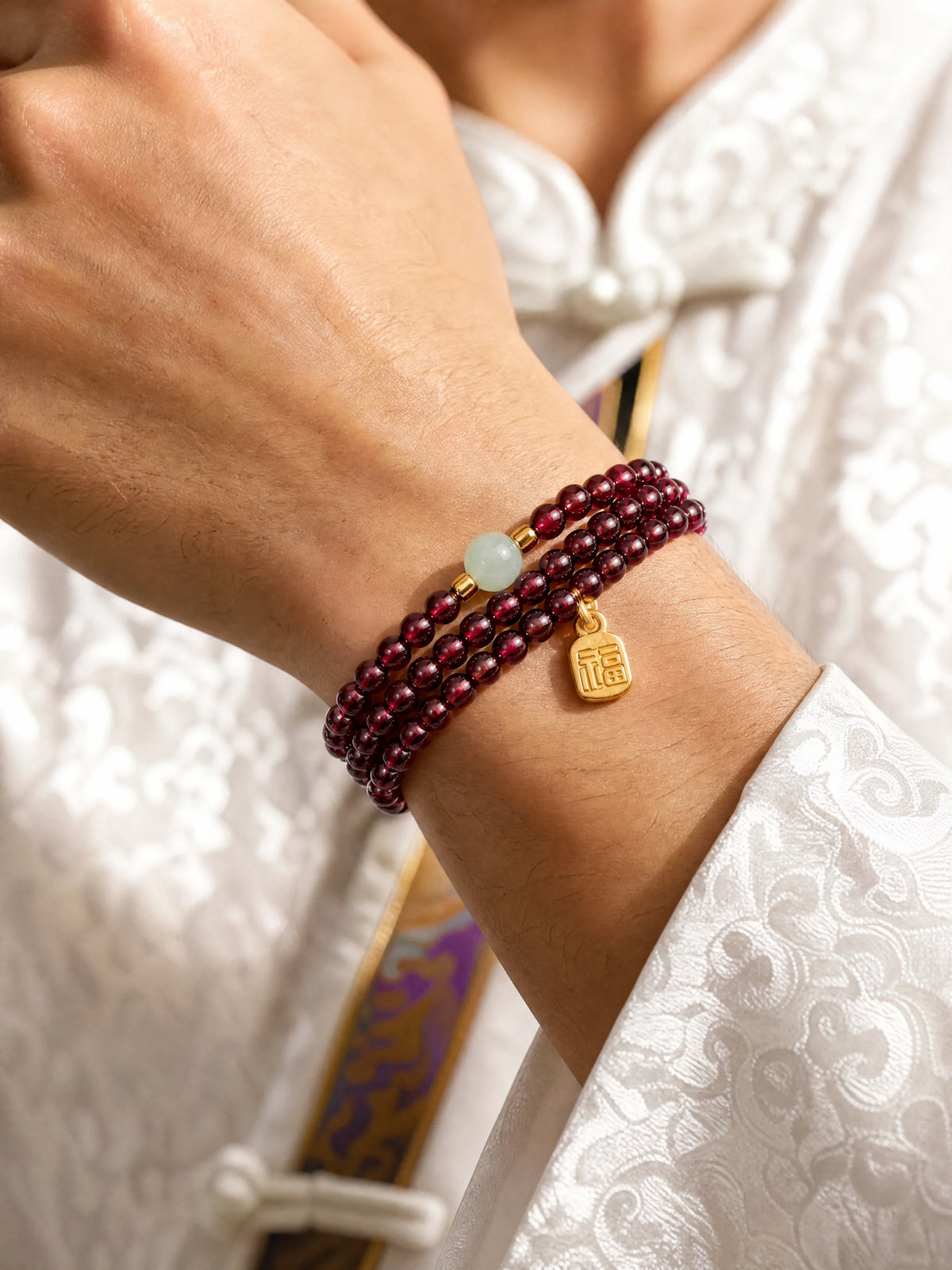 garnet-triple-wrap-fu-charm-bracelet-model-a-outfit-a-closeup-01