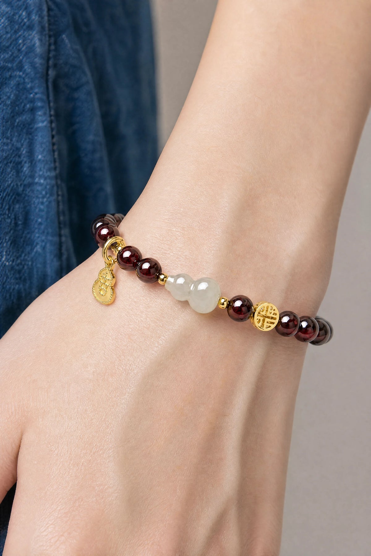 garnet-white-jade-gourd-bracelet-model-a-outfit-a-closeup-01