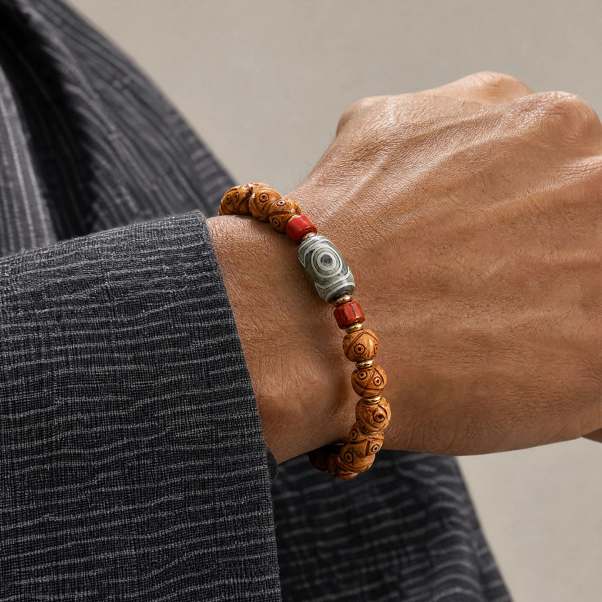 golden-yak-bone-dzi-bracelet-model-a-outfit-a-closeup-01