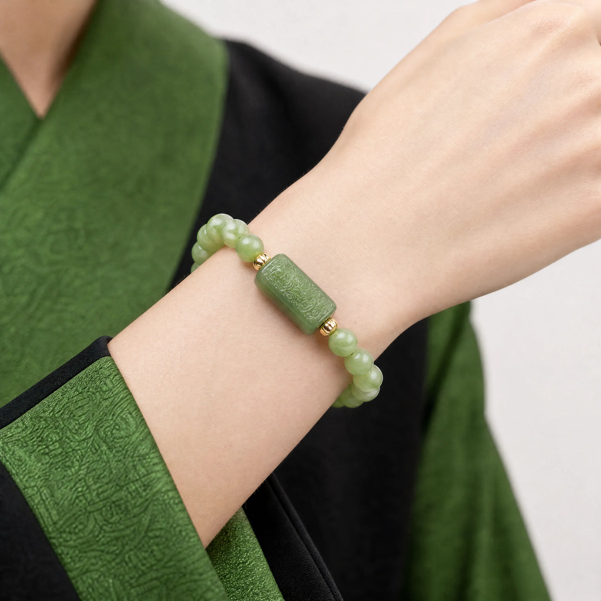 green-jade-cloud-plaque-6mm-bracelet-model-a-outfit-a-closeup-01