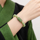 green-jade-cloud-plaque-6mm-bracelet-model-a-outfit-a-closeup-01