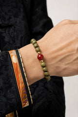 green-sandalwood-cinnabar-mala-bracelet-model-a-outfit-a-closeup-01