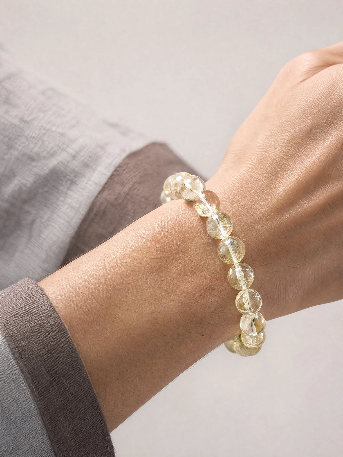 lemon-citrine-round-bead-bracelet-model-a-outfit-a-closeup-01