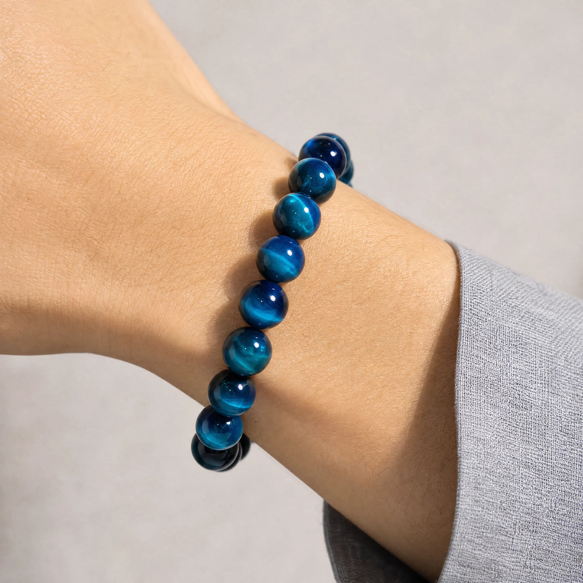 light-blue-tiger-eye-bracelet-model-a-outfit-a-closeup-01