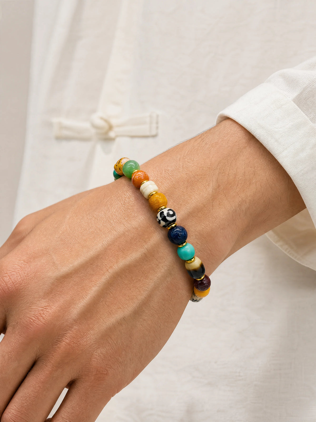 multicolor-yak-bone-treasure-bracelet-10mm-model-a-outfit-a-closeup-01