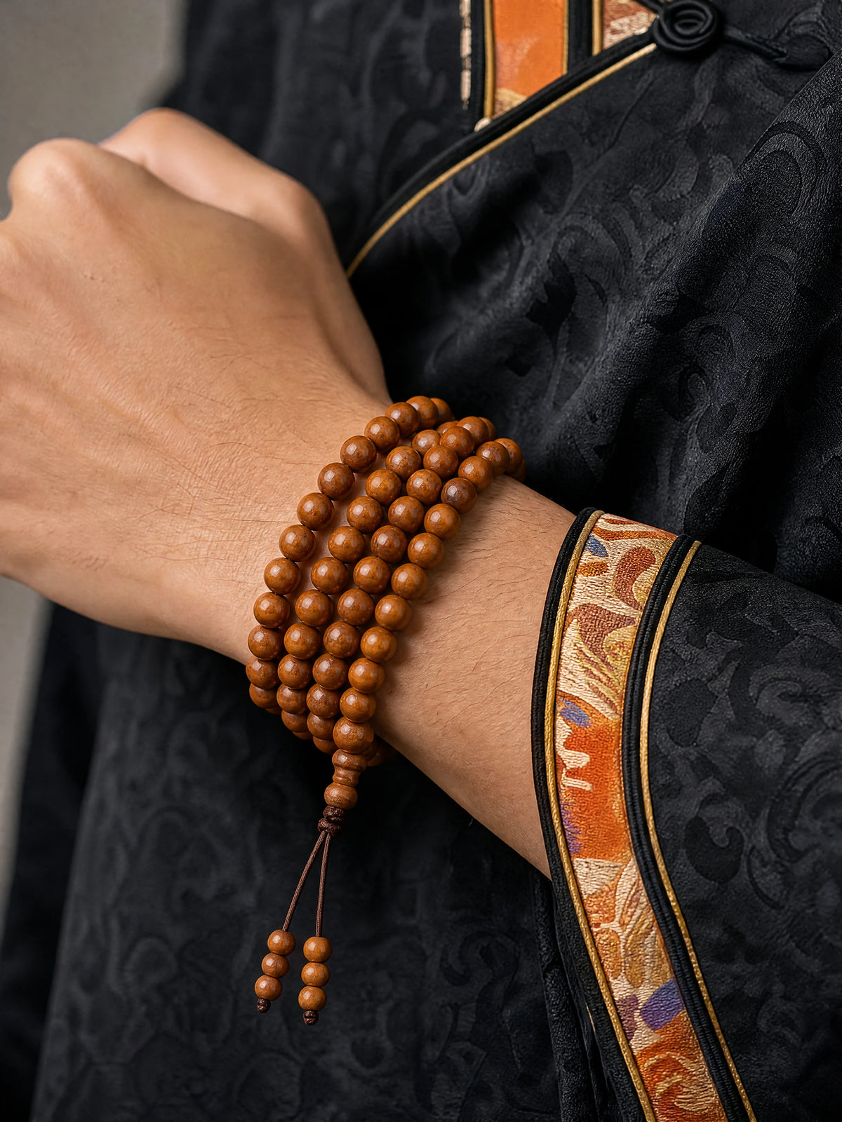 peach-wood-108-bead-mala-bracelet-model-a-outfit-a-closeup-01
