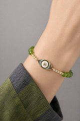 peridot-evil-eye-bracelet-protection-model-a-outfit-a-closeup-01