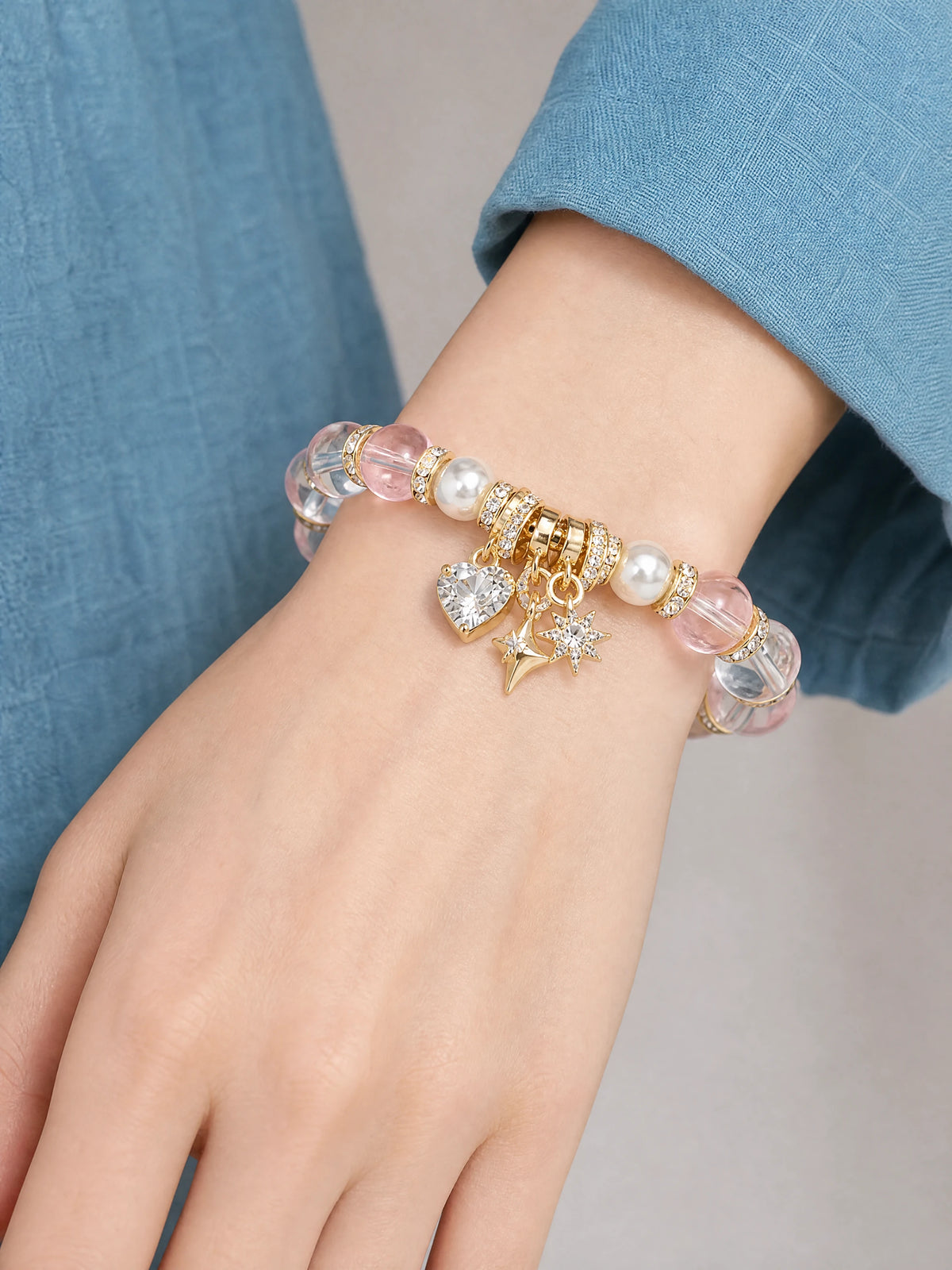 pink-crystal-heart-star-charm-bracelet-model-a-outfit-a-closeup-01