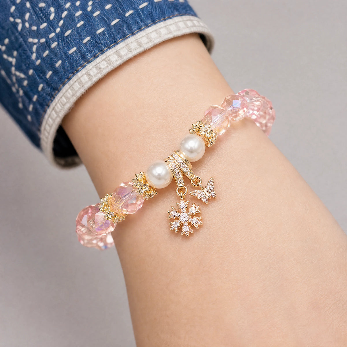pink-crystal-pearl-butterfly-bracelet-model-a-outfit-a-closeup-01