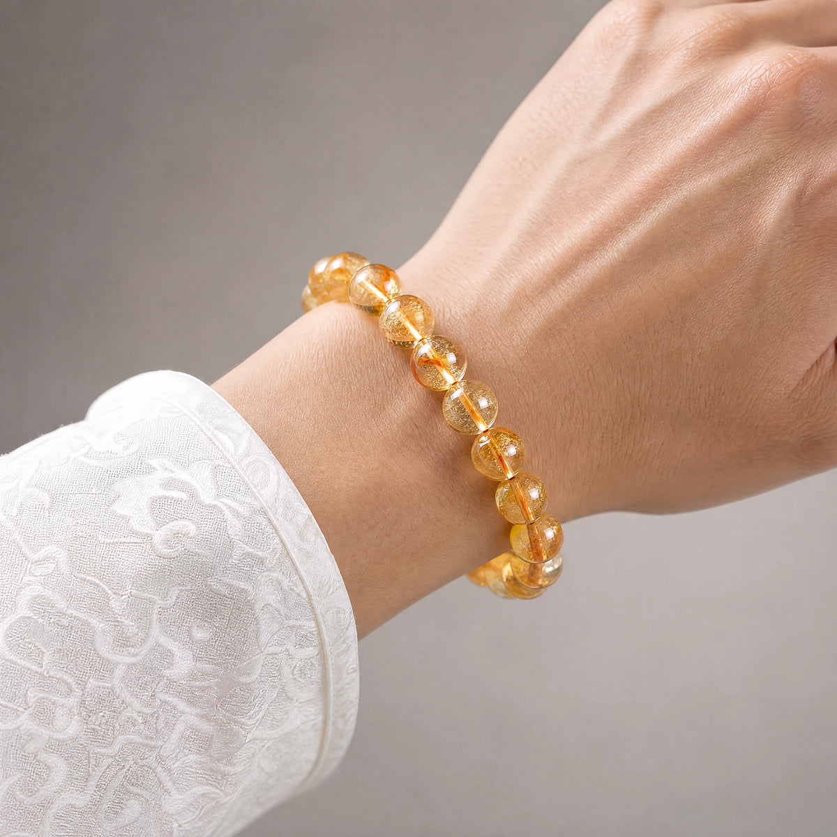 pyramid-cut-citrine-bead-bracelet-model-a-outfit-a-closeup-01