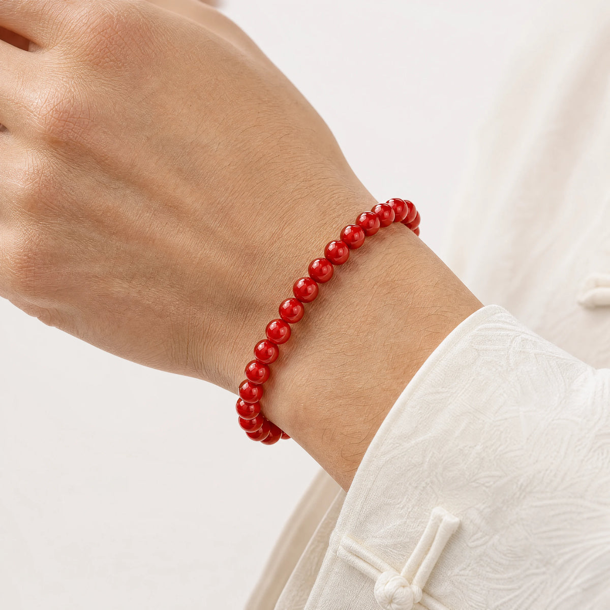 red-agate-plain-bead-bracelet-model-a-outfit-a-closeup-01