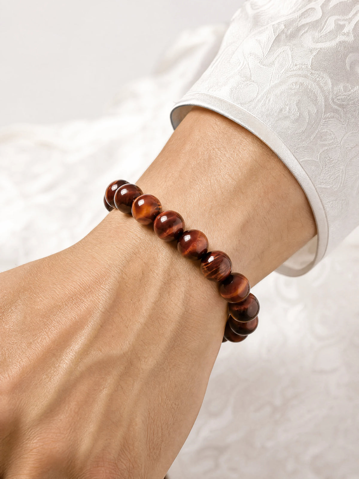 red-tiger-eye-bead-bracelet-model-a-outfit-a-closeup-01