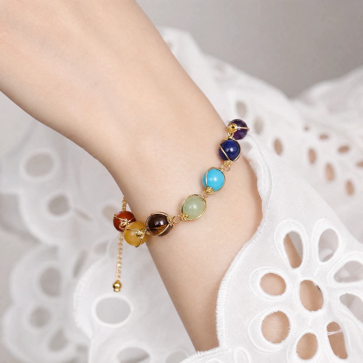 seven-chakra-sliding-chain-bracelet-model-a-outfit-a-closeup-01