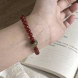 Red Agate & Jadeite Running Ring Bracelet — A Loose Green Ring on a Red Strand - 6mm with Running RingTibet Art