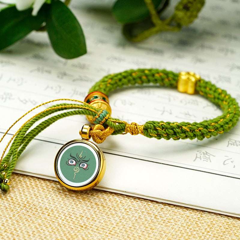 Tibetan Fortune Eye Braided Bracelet — Woven Lucky Cord with Dharma Eye Charm & Prayer Wheel Bead Tibet Art