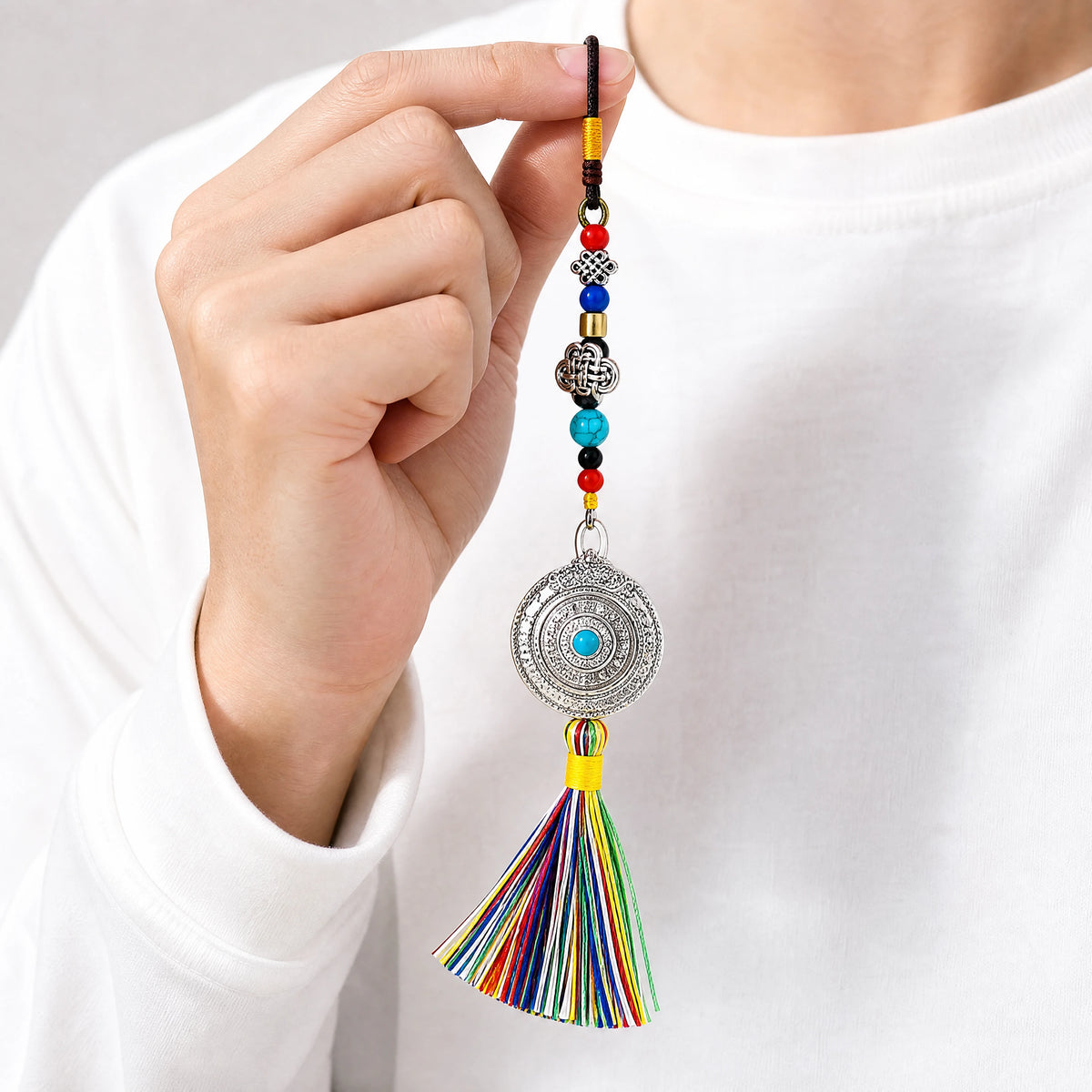 tibetan-zodiac-tassel-keychain-model-a-outfit-a-closeup-01