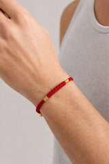 vajra-knot-red-cord-clasp-bracelet-model-a-outfit-a-closeup-01