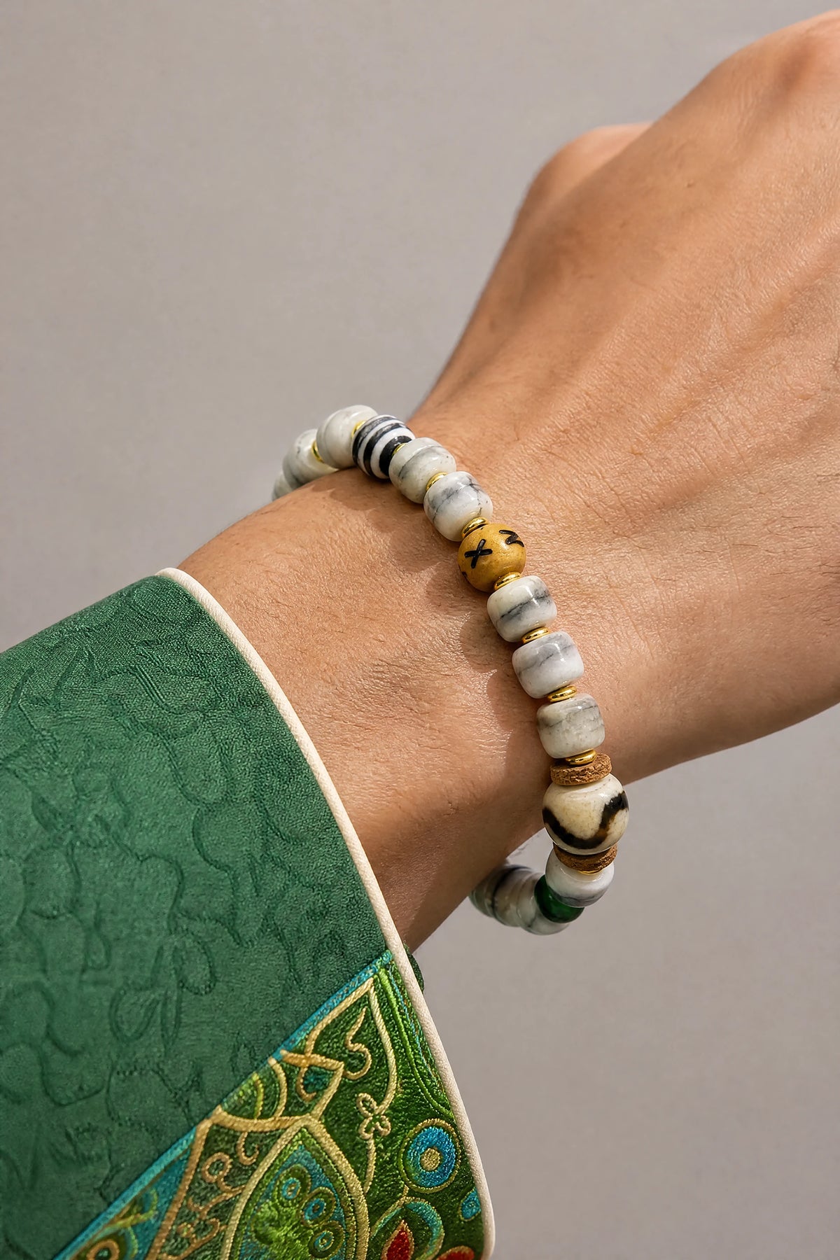 white-yak-bone-tiger-tooth-dzi-bracelet-10mm-model-a-outfit-a-closeup-01