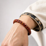 yak-bone-barrel-bead-bracelet-model-a-outfit-a-closeup-01