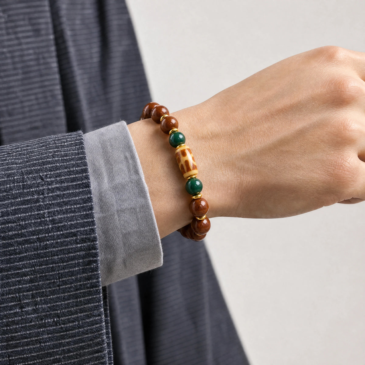 yak-bone-benefactor-dzi-bracelet-10mm-model-a-outfit-a-closeup-01