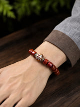 yak-bone-geometric-dzi-style-bracelet-model-a-outfit-a-closeup-01