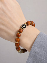 yak-bone-one-eye-dzi-metal-accent-bracelet-model-a-outfit-a-closeup-01