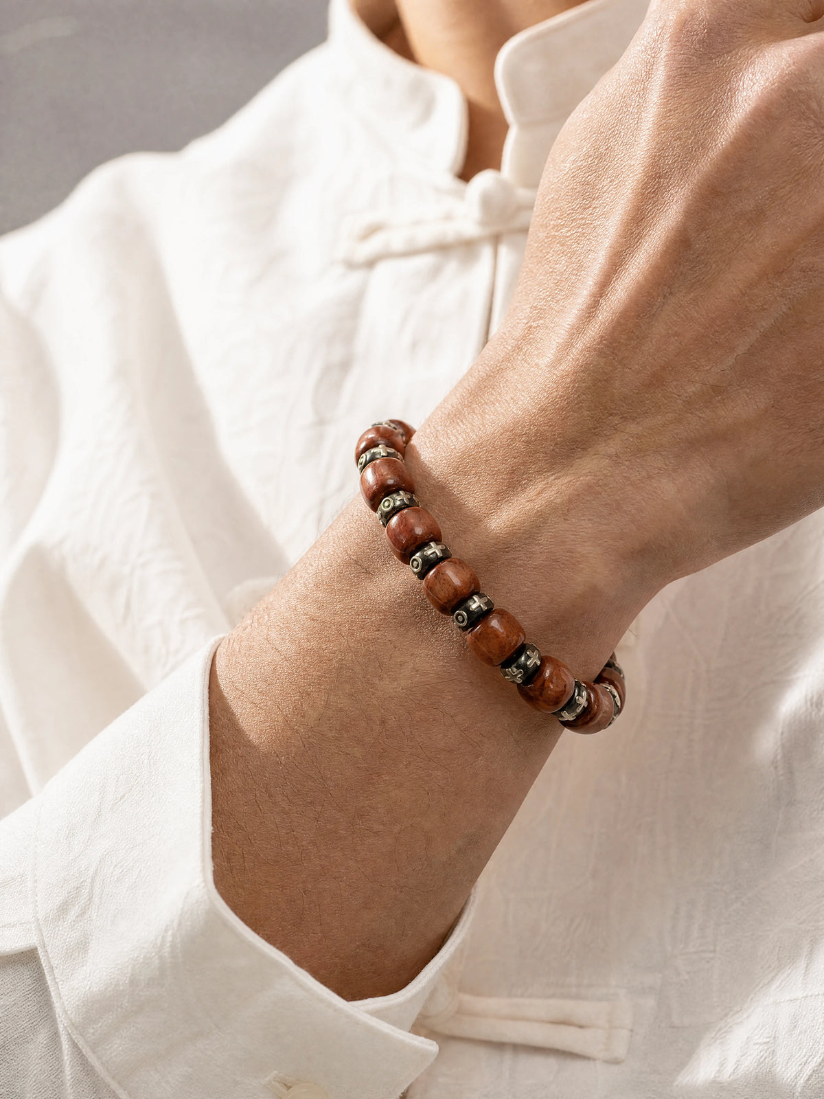 yak-bone-six-syllable-mantra-spacer-bracelet-model-a-outfit-a-closeup-01