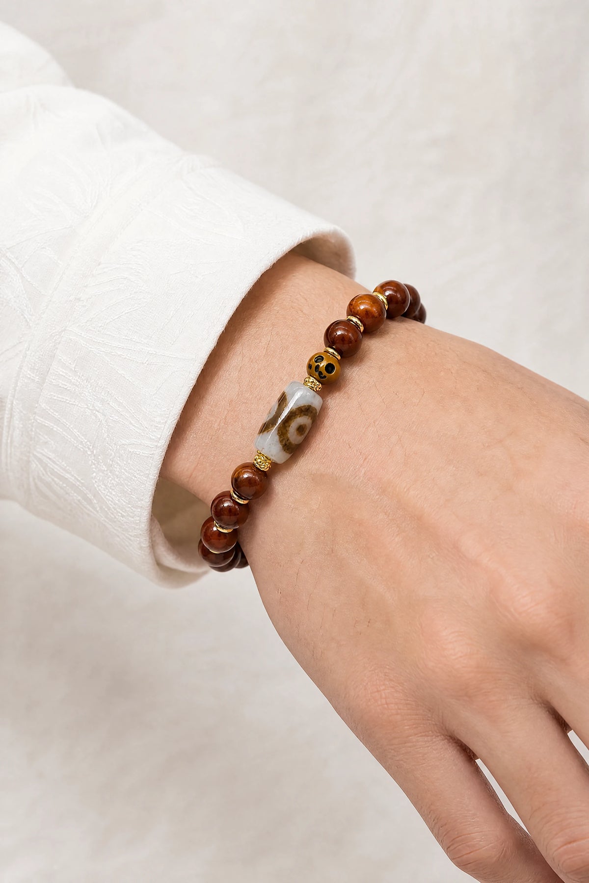 yak-bone-three-eye-dzi-bracelet-10mm-model-a-outfit-a-closeup-01