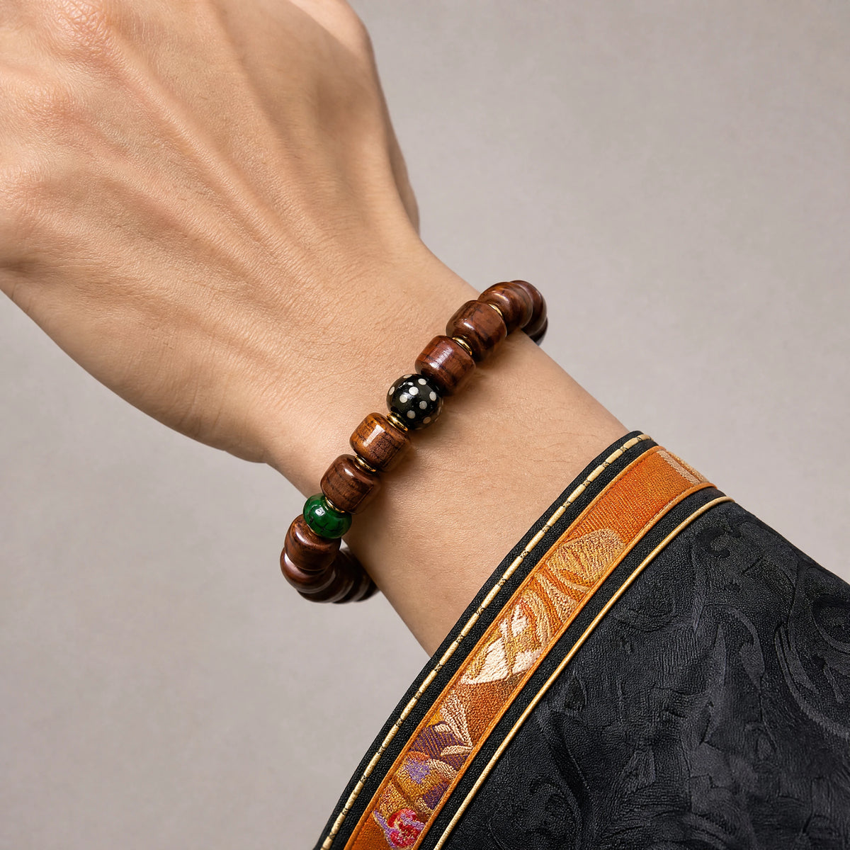 yak-bone-tiger-tooth-dzi-bracelet-12mm-model-a-outfit-a-closeup-01