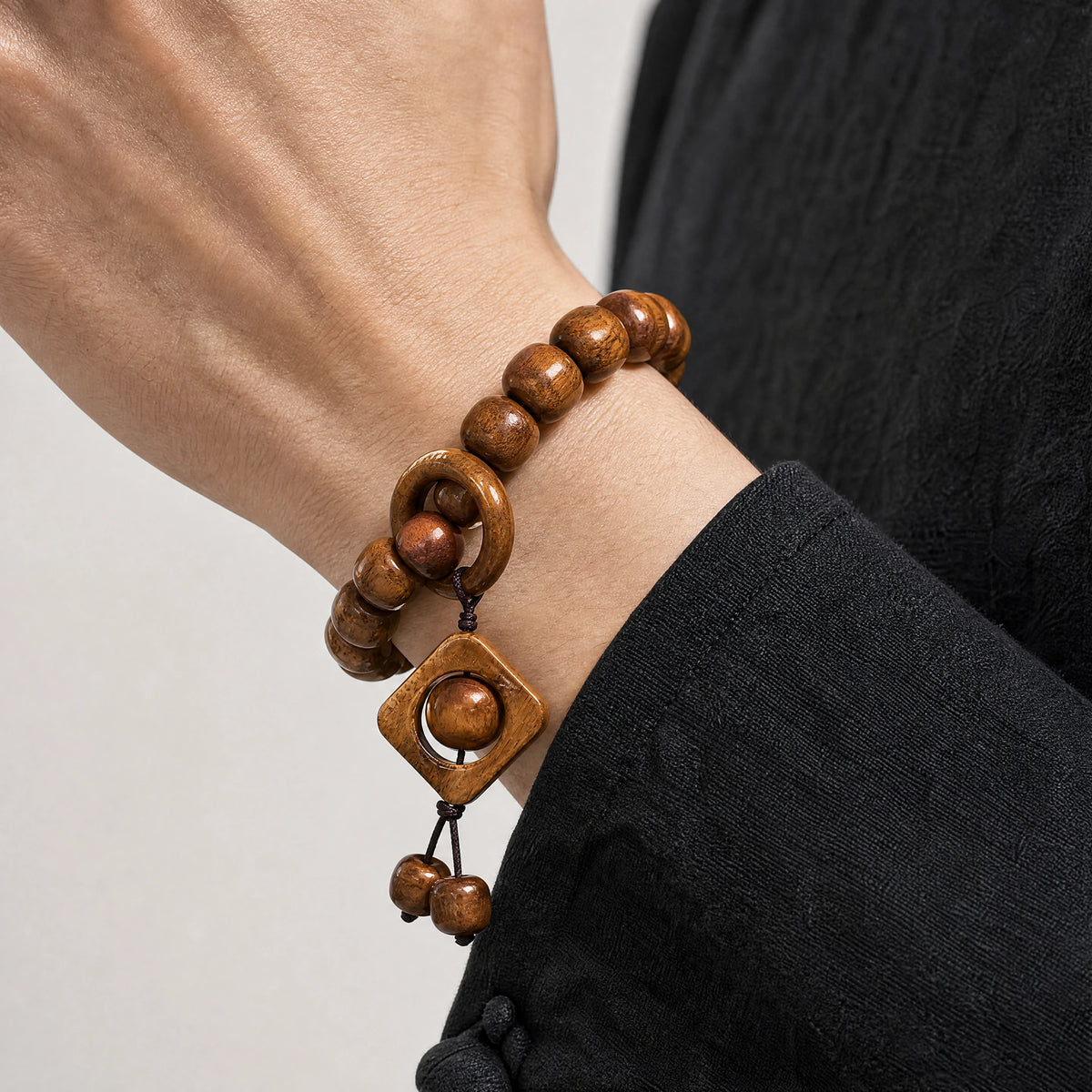 yak-bone-turning-fortune-charm-bracelet-model-a-outfit-a-closeup-01